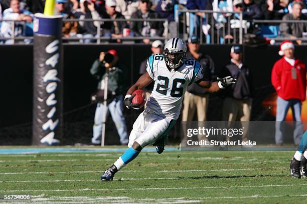 Running back DeShaun Foster of the Carolina Panthers carries the ball against the Dallas Cowboys at Bank of America Stadium on December 24, 2005 in...