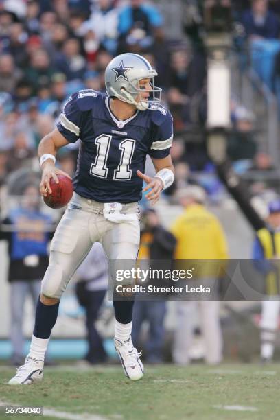 Quarterback Drew Bledsoe of the Dallas Cowboys drops back to pass against the Carolina Panthers at Bank of America Stadium on December 24, 2005 in...