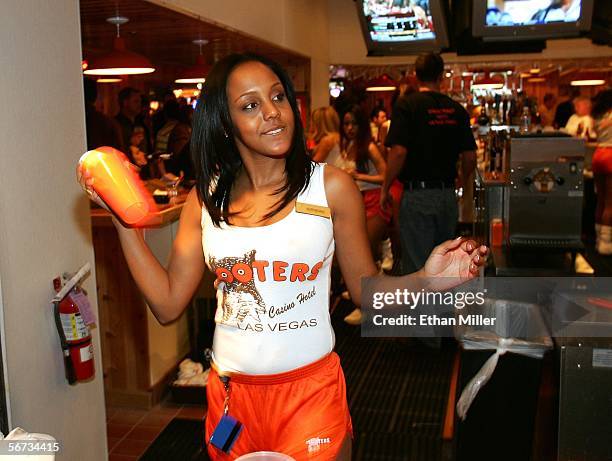 Bartender Adrienne Turner makes a drink at the Hooters Restaurant during the grand opening of the Hooters Casino Hotel February 2, 2006 in Las Vegas,...