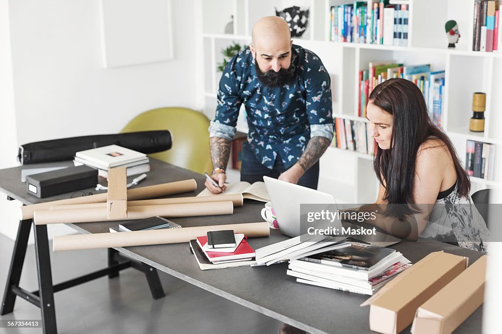 Architects using laptop at home office