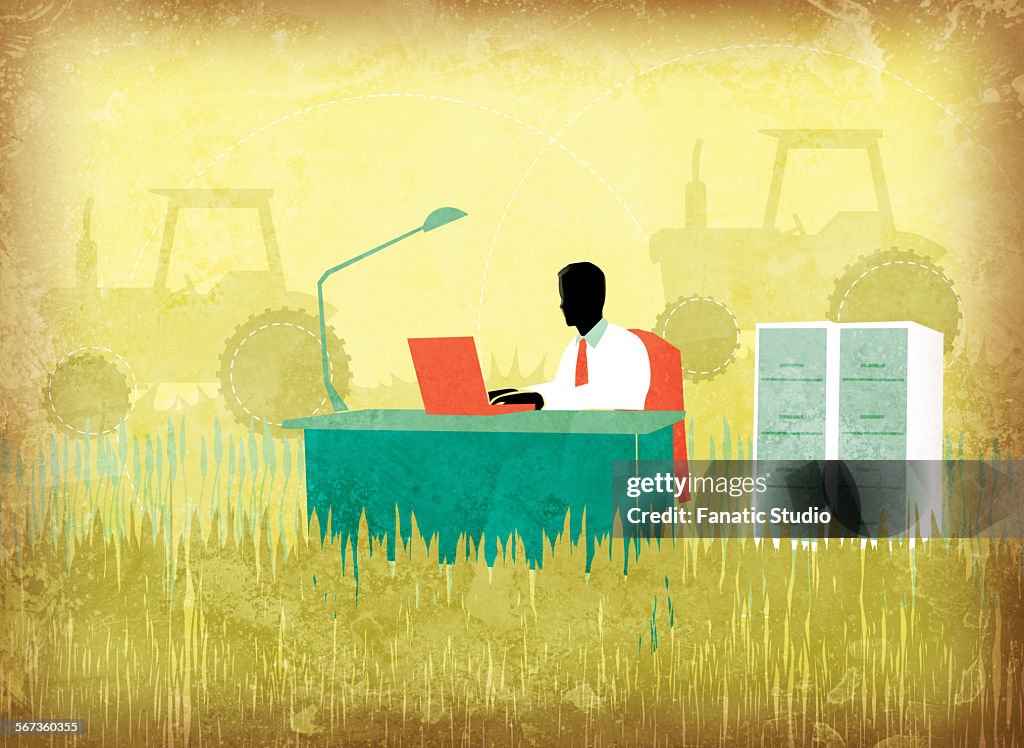 Illustration image of businessman using laptop on agricultural field