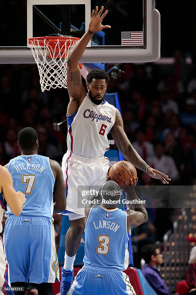 LOS ANGELES, CA, MONDAY, JANUARY 26, 2015 -Clippers center DeAndre Jordan jumps early in an attempt 