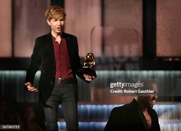 February 8, 2015 Kanye West , right, avoids contact with an inviting Beck after Beck won Album of the Year at the 57th Annual GRAMMY Awards at...
