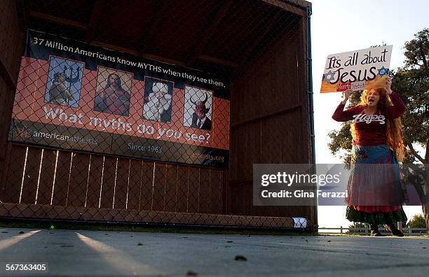 Vikki Hill of Santa Monica protests in front of an atheist's group display where Nativity scenes use to be at Pacific Palisades Park along Ocean...