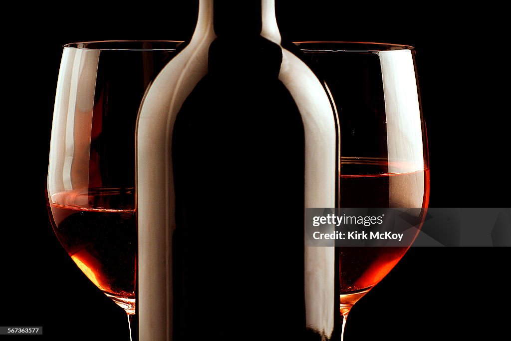 Stock wine photo of a glass of two glasses of Red Wine with the bottle.