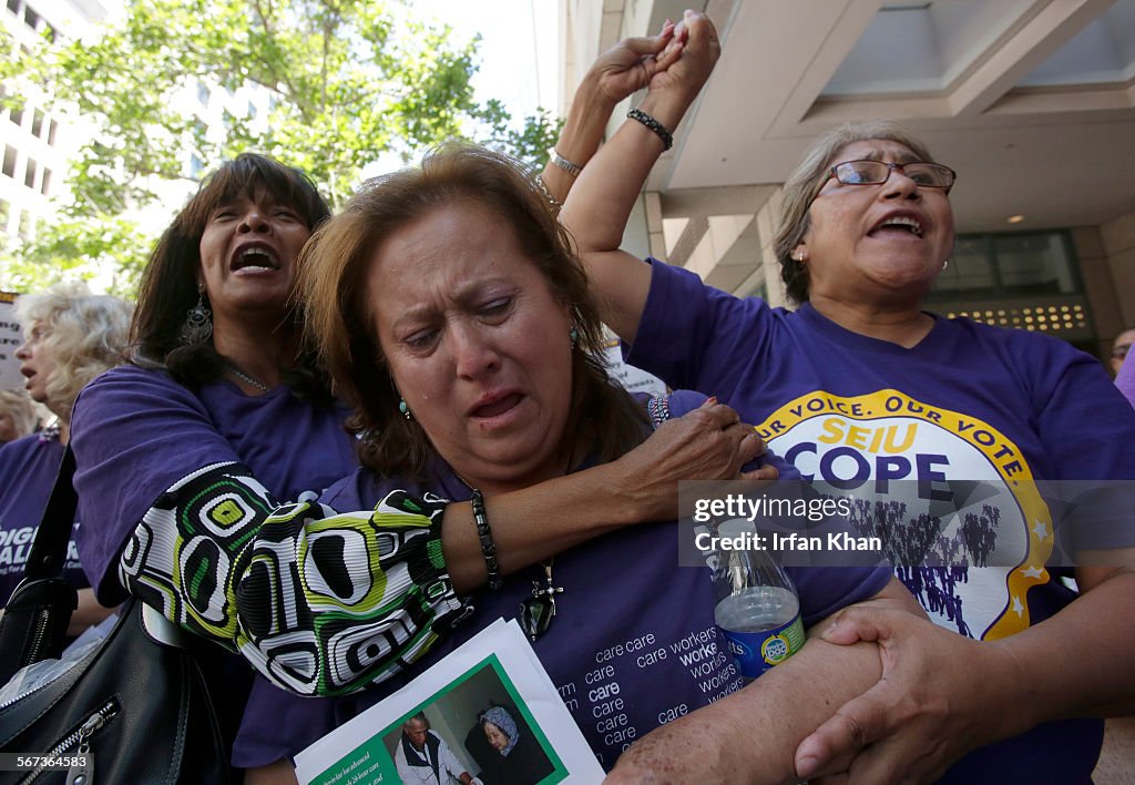 LOS ANGELES, CA MAY 13, 2014 --- Zoila Ramirez, center, who takes care of her 25-year-old autistic s