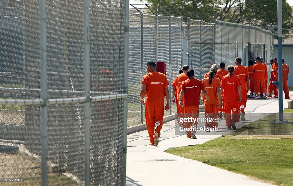 BAKERSFIELD, CA AUGUST 8, 2014 -- Inmates walk through the yard at the Kern County Sheriff's Offic