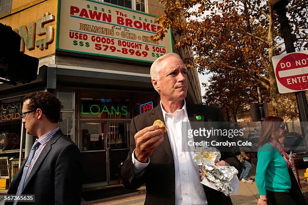 Bridgeport mayor, Bill Finch eats a hotdog in downtown Bridgeport on Broad Street across from his office on Oct. 29, 2014. This is his second term in...