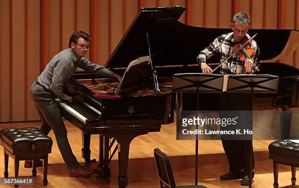 Richard Valitutto, piano and Mark Menzies, violin in Ramon Lazkano's "Laboratory of Chalks" at the Monday Evening Concerts at Zipper Concert Hall,...