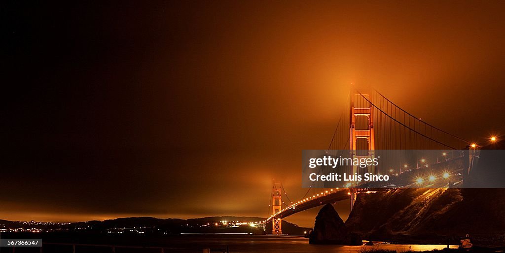 Sinco, Luis ââ â 121433.ME.0306.lighthous.9.LS. Fog wafts over the Golden Gate Bridge as seen