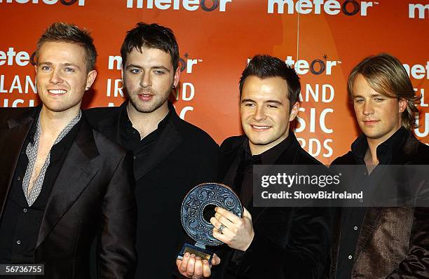 Kian Egan, Mark Feehily, Shane Filan and Nicky Byrne of Westlife pose with their award for Best Irish Pop Act at The Meteor Ireland Music Awards...