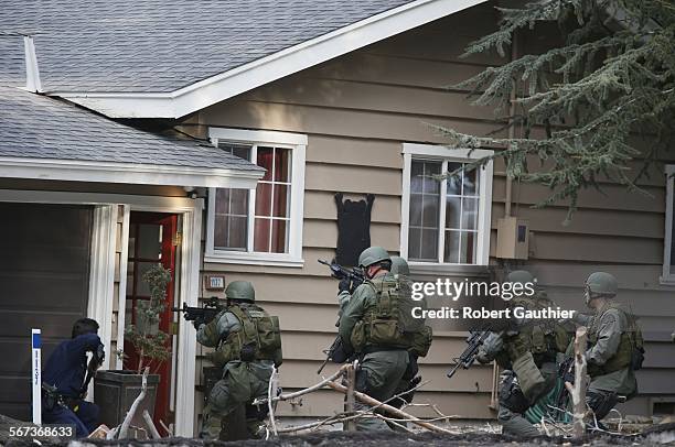 Team enters a home on Club View Drive in Big Bear searching for suspect Christopher Dorner. Law enforcement agencies swarmed the mountain community...