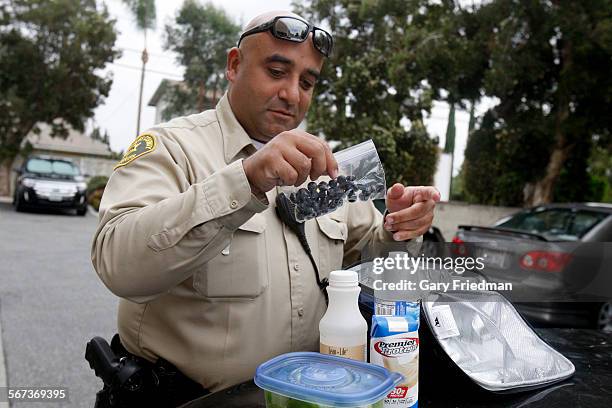 Los Angeles County Sheriff Deputy Michael Tadrous begins his lunch outside the Lindora Clinic after he was weighed on August 19 in Downey. Tadrous,...