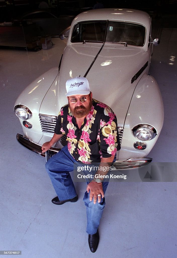 Boyd Coddington , next to a customer's 1941 Cadillac. At his Shop in Anaheim. Boyd is considered the