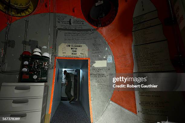 Missile combat crew member 2nd Lt. Wesley Griffith prepares to close a three foot thick door inside a launch control center at Malmstrom AFB. Located...