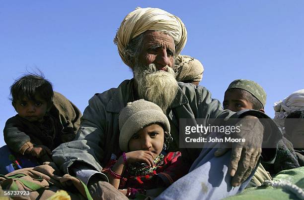 Bugti tribespeople flee violence on February 3, 2006 in the Dera Bugti valley of the Pakistani province of Balochistan. Continued fighting between...