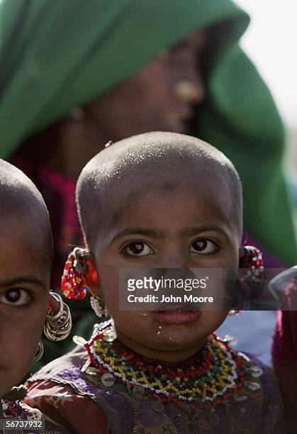 Young Bugti child looks on as Bugti tribespeople flee violence on February 3, 2006 in the Dera Bugti valley of the Pakistani province of Balochistan....