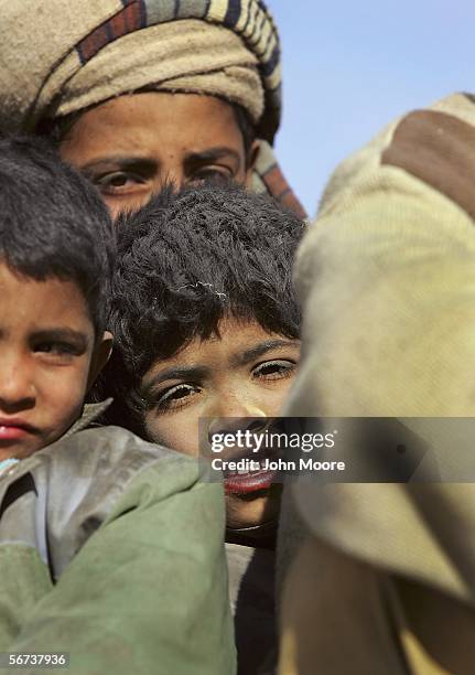 Young Bugti child looks on as Bugti tribespeople flee violence on February 3, 2006 in the Dera Bugti valley of the Pakistani province of Balochistan....