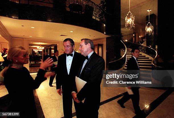 Heart Ball.2.0221.CW Pamela M. Mullin, left, Charles C. Reed, center, and Byron E. Allumbaugh, right, talk prior to the the start of the American...