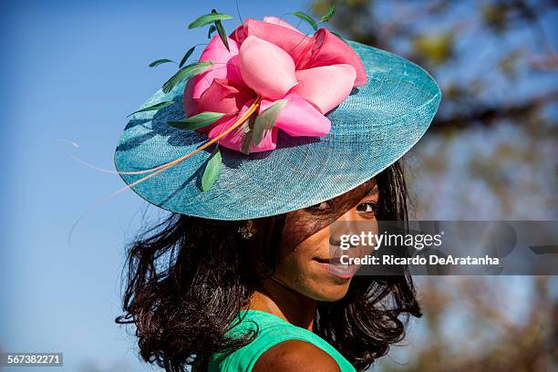 Model Ciara Austin, cq, posing wearing a hat by Christine A. Moore Millinery at Santa Anita Park, September 26, 2014. Christine A. Moore Millinery is...