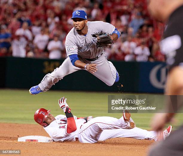 October 3, 2014. Angels Eric Aybar is out at second while Royal's Alcides Escobar flies over him after David Freese hit into a double play in the...