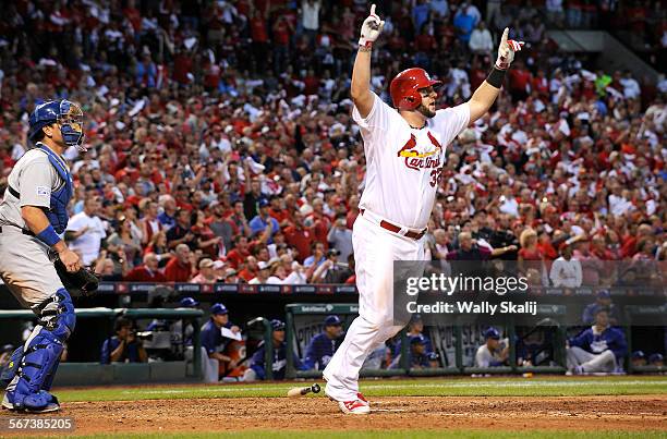 Cardnials Matt Adams hits a three-run home run off Dodger pitcher Clayton Kershaw in the 7th inning in Game 4 of the NLDS in St. Louis Tuesday.