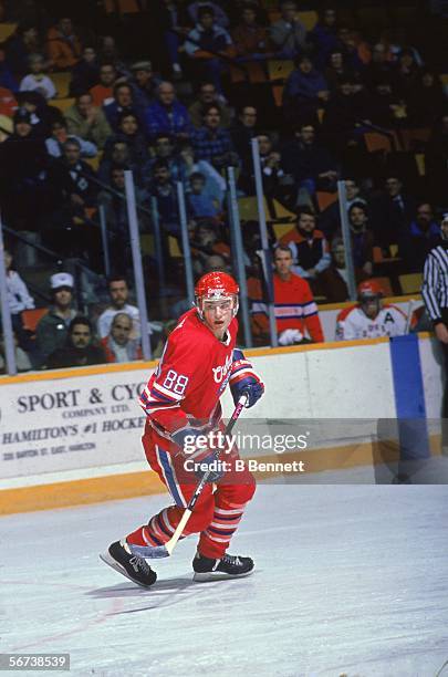 Canadian professional hockey player Eric Lindros skates on the ice in a road game against the Hamilton Dukes during his minor league days with the...