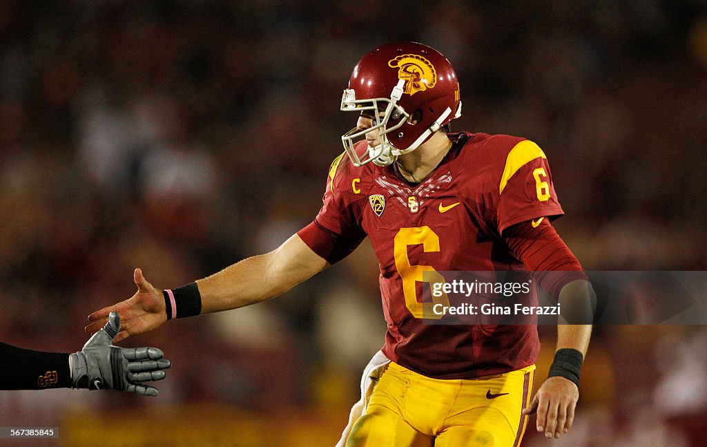 LOS ANGELES, CA - SEPTEMBER 27, 2014: USC Trojans quarterback Cody Kessler (6) shakes hands with  hi