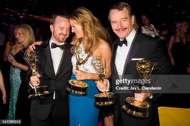 Aaron Paul, left, with his Emmy for best supporting actor in a drama series, Anna Gunn, best supporting actress in a drama series and Bryan Cranston,...