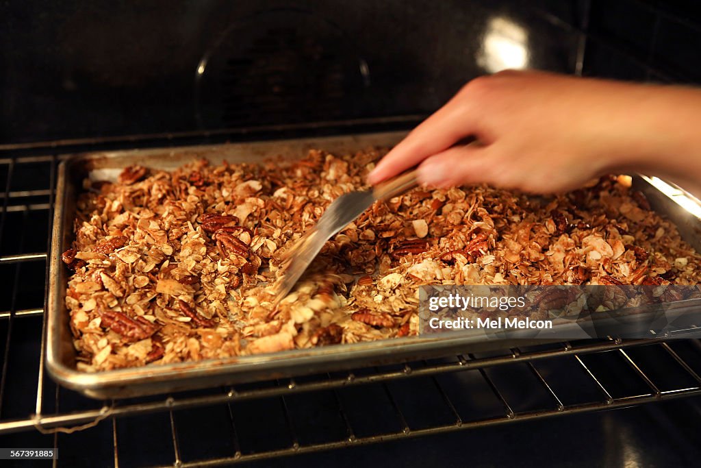 LOS ANGELES, CA-AUGUST 20, 2014:  Homemade Granola step by step-toast until golden brown, tossing oc