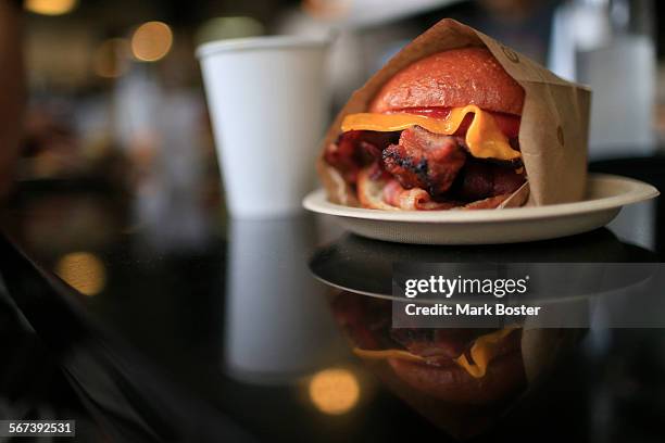 Eggslut serves fresh egg sandwiches with a variety additions like bacon and cheese at Grand Central Market August 7, 2014 .