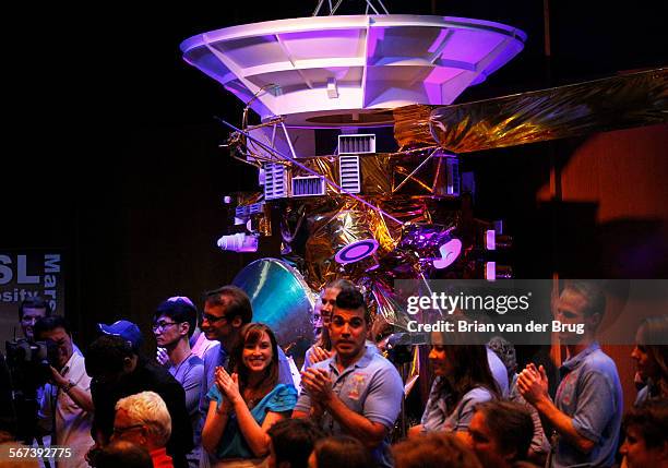 Pasadena, CA, United States: Sunday, August 5, 2012  Activity lead Bobak Ferdowsi, center, applauds with others at ceremony after a successful...