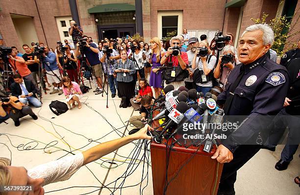 South Pasadena Police Chief Arthur Miller, right, on Tuesday Aug. 19 addresses a press conference on the detention of two teen students suspected of...