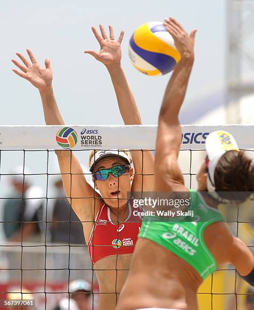 S April Ross blocks a shot by Brazil's Barbara Seixas of the gold medal match in the Asics World Series of Volleyball in Long Beach Sunday.