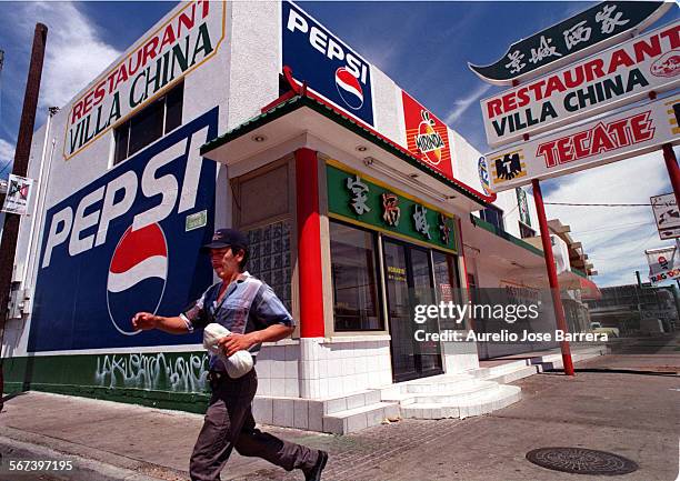 Mexicali.VillaChina.0727.AJBA painted Pepsi sign covers the southside wall of the Villa China Chinese restaurant in Mexicali, Mexico.