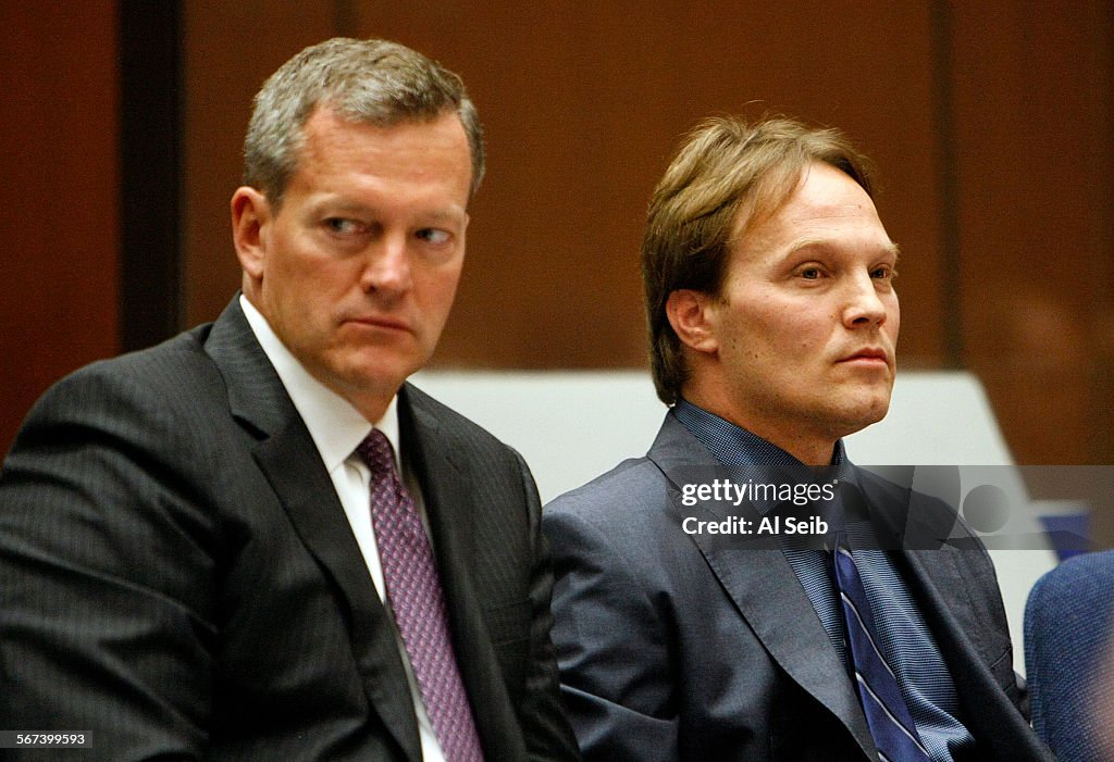 LOS ANGELES, CA JUNE 20, 2014 - UCLA chemistry professor Patrick Harran, right, sits with his atto
