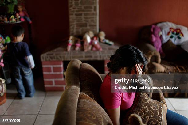 Year-old Sindy Marieliza Laurel Palma sits in her family's home recalling her ordeal in trying to reach the United States with her sister. She was...