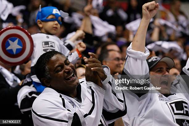 Fans cheer after the Kings score their third goal in the first period against the Blackhawks in game four of the Stanley Cup Western Conference...