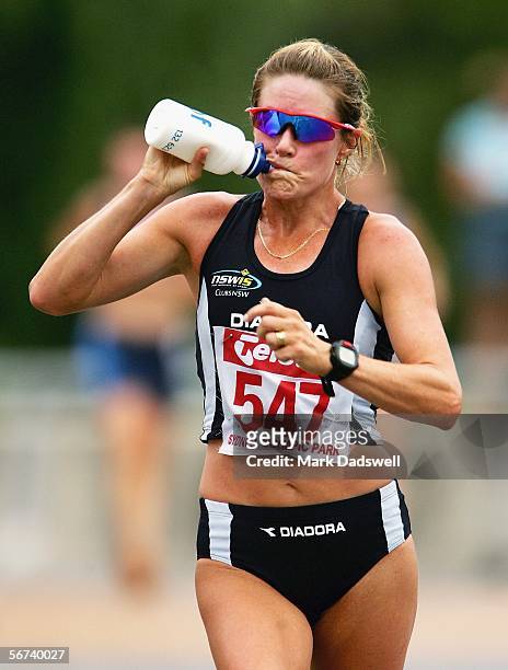 Jane Saville of the NSWIS takes on fluid on her way to winning the Women's 20k Race Walk during day three of the Athletics Australia Telstra A-series...