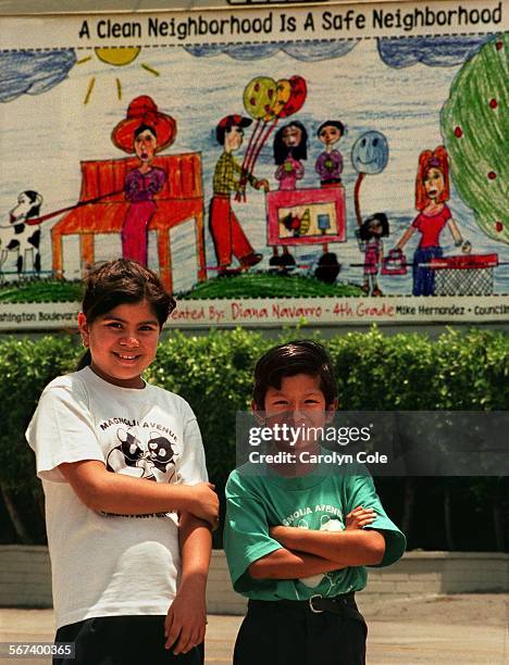 Billboard.0625.CC; Diana Navarro who is in the 4th grade, and Jesus Palacios in kindergarden, are grand prize winners in the contest held at Magnolia...