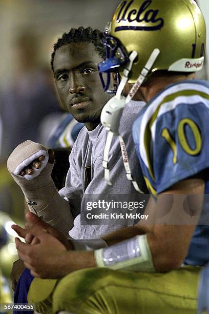 UCLAvsASU.09.KMUCLA's runningback DeShaun Foster , talking to teammate and quarterback Cory Paus, fractured his wrist and is expected to be out for...