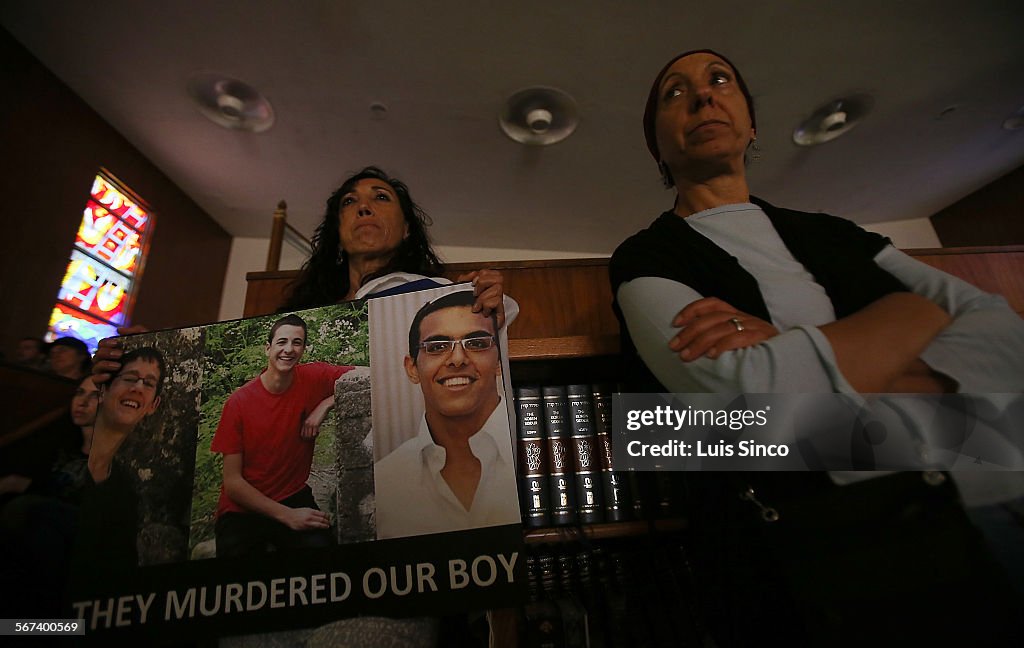 BEVERLY HILLS, CALIF. -  JULY 1, 2014. Hana Kadosh, left, holds pictures of three slain West Bank se