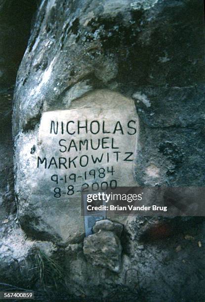 Rock at the site where body of Nicholas Markowitz was found in a shallow grave in the hills outside Goleta has been etched into a gravestone...