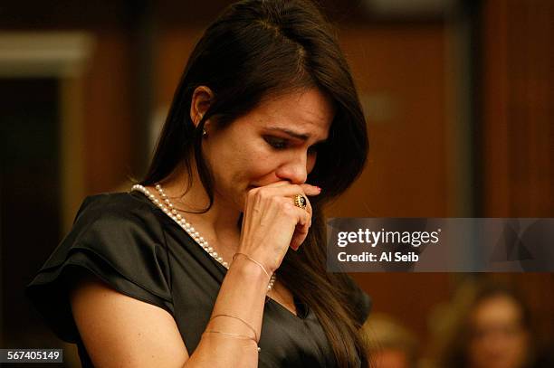 Monica Andreny weeps as she makes a victim impact statement Wednesday, June 18 in San Fernando courtroom, where he husband, Dino Guglielmelli, was...