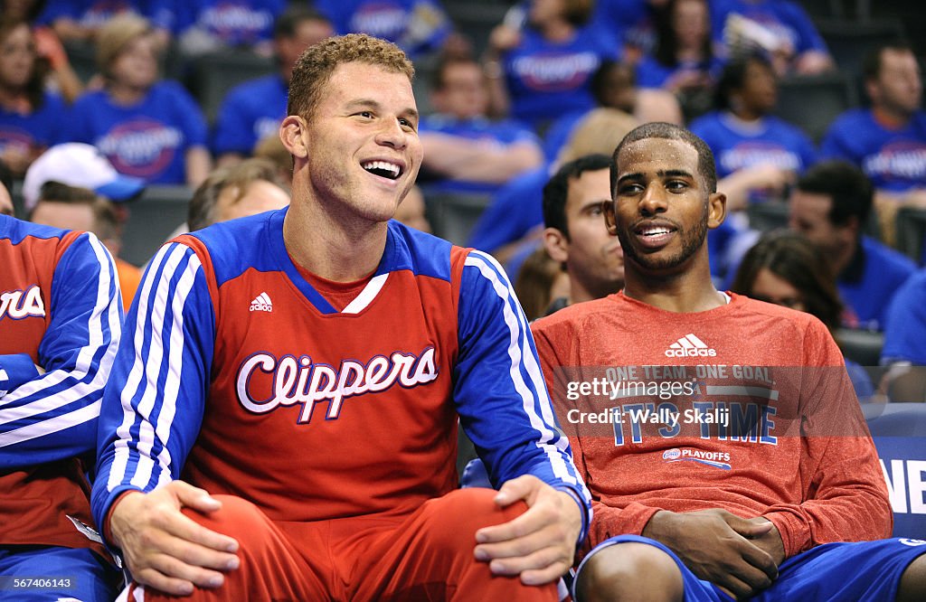 OKLAHOMA CITY, OKLAHOMA, MAY 5, 2014-Clippers Blake Griffin, left, and Chris Paul sit on the bench i