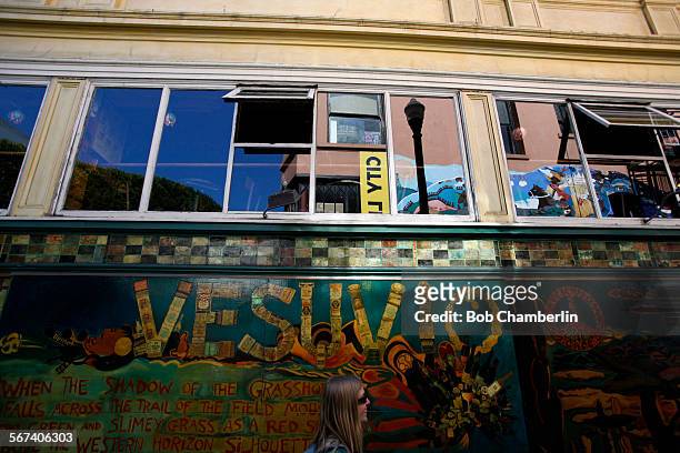 Emily Brosk of Yosemite, walks past the Vesuvio Bar across Jack Kerouac alley from the City Lights Bookstore on MARCH 07, 2014. Founded by Lawrence...