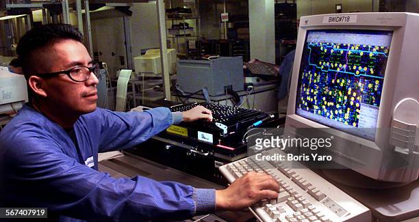 Teradyne employe Will Rodas runs test on a PC board at the Agoura Hills company on June 14, 2000.^^^/LA Times
