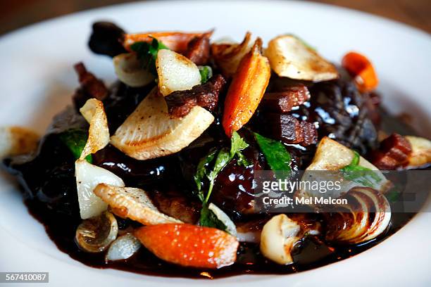 Guinea fowel "coq au vin," anson mills bule grits, benton's bacon, is on the menu at Animal Restaurant on Fairfax Ave. In Los Angeles on April 11,...