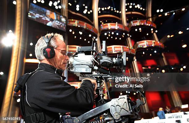 Steadicam operator David Eastwood focuses his camera in the house during rehearsals inside the Dolby Theater at Hollywood and Highland on February...