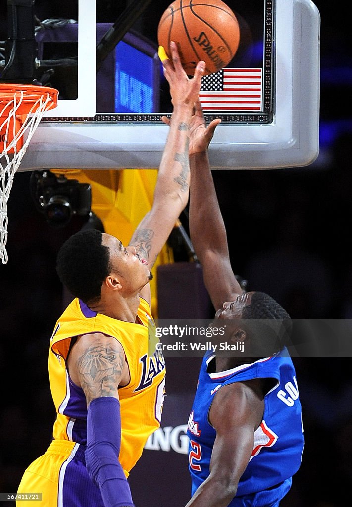 LOS ANGELES,CALIFORNIA MARCH 6, 2014-Lakers Kent Bazemore blocks the shot of Clippers Darren Colliso
